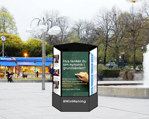 An illustration of screens put set in a hexagon shape you can walk around, placed near a subway station